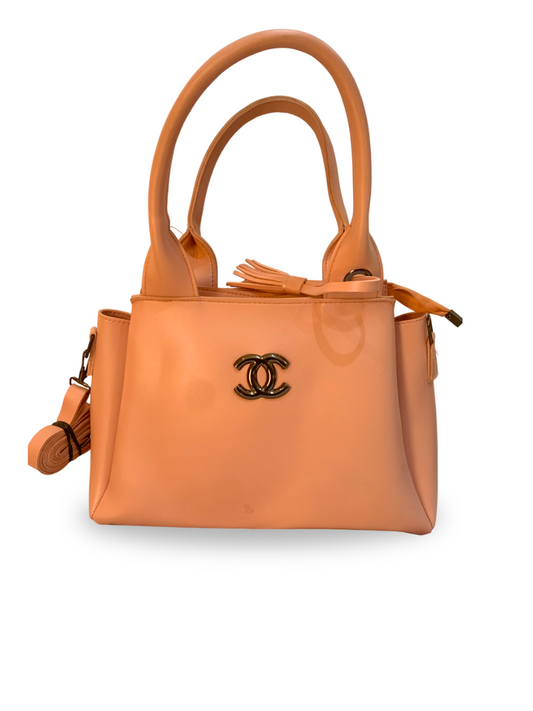 Chic Peach Handbag with Elegant Logo Accent